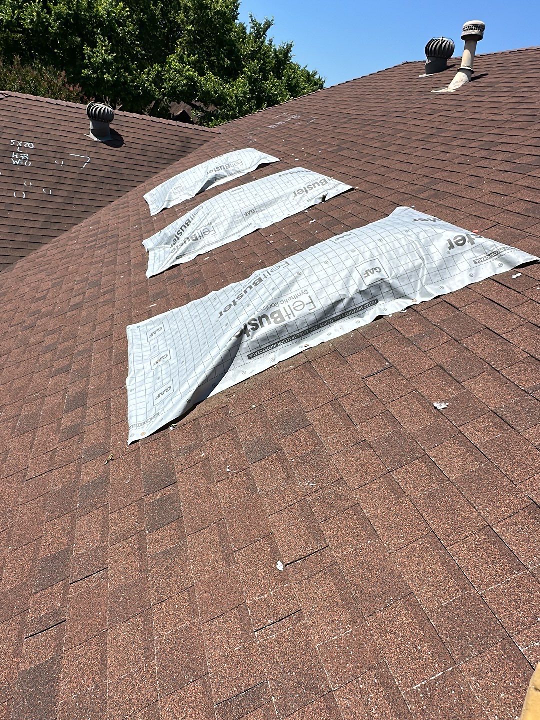 Image of a home in prosper, Texas with the roof and skylights currently being replaced by MD roofing and construction