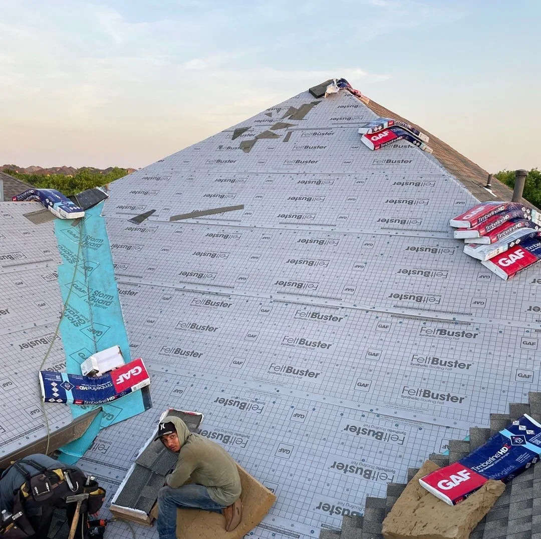 Image of a roof replacement in progress in Frisco Texas. Performed by Micheal Lance's team at MD roofing and construction.